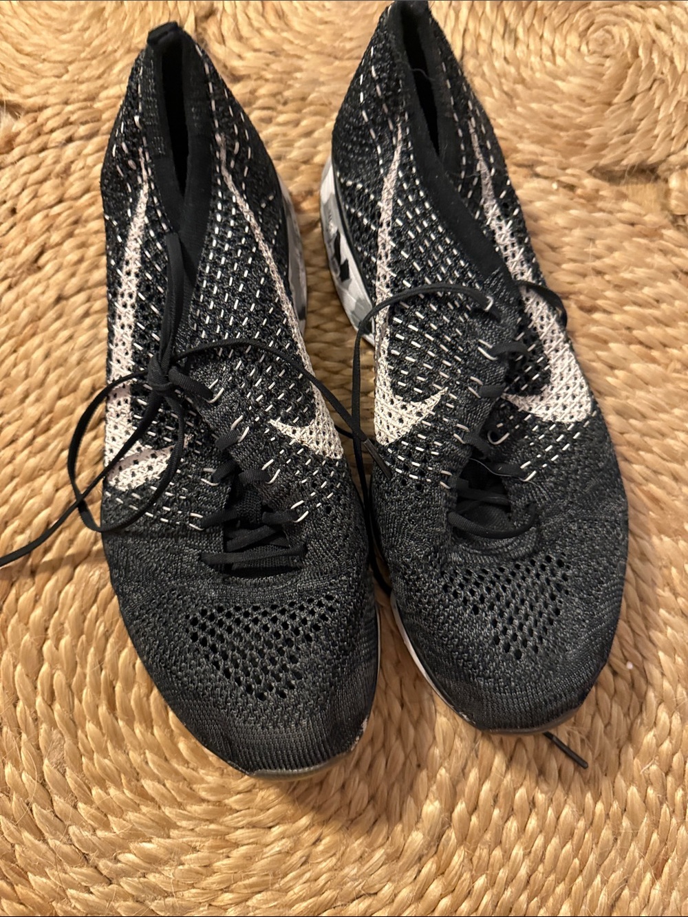 Nike Women’s Black and White Flyknit Athletic Sneakers